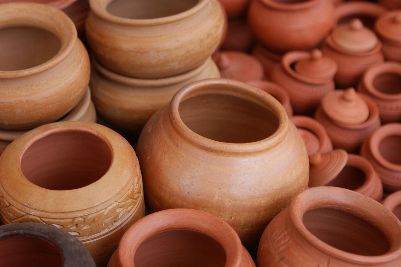 Terracotta plant pots on minimalist shelves. Terracotta plant pots on minimalist shelves.