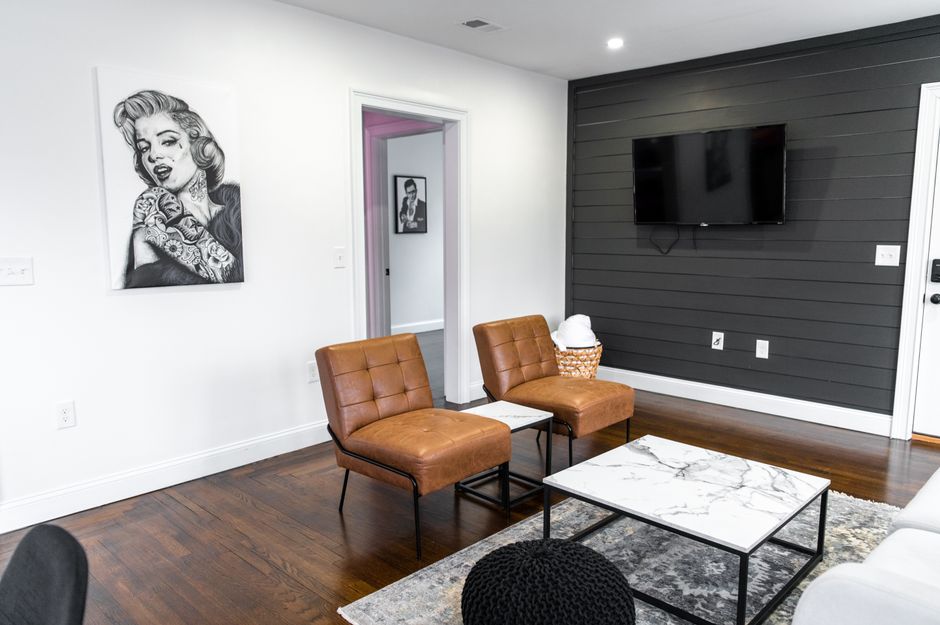 Black accent wall with stylish decor elements. Black accent wall with stylish decor elements.