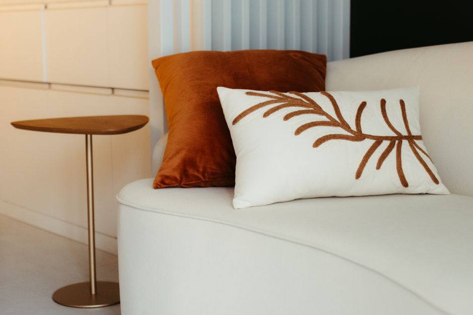 Living room with sunny decor and embroidered pillows. Living room with sunny decor and embroidered pillows.