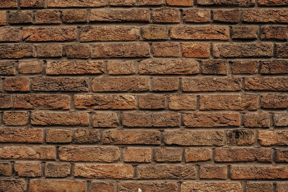 Textured brick wallpaper adds cozy, elegant vibe.