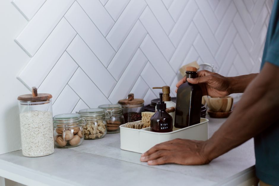Glass jars filled with eco-friendly cleaning supplies. Glass jars filled with eco-friendly cleaning supplies.