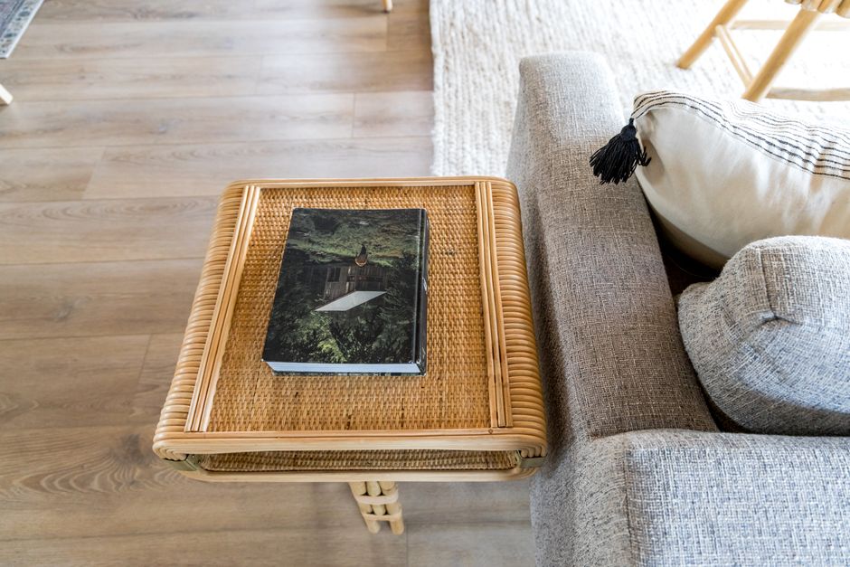 Cozy reading nook with rattan bookshelf. Cozy reading nook with rattan bookshelf.