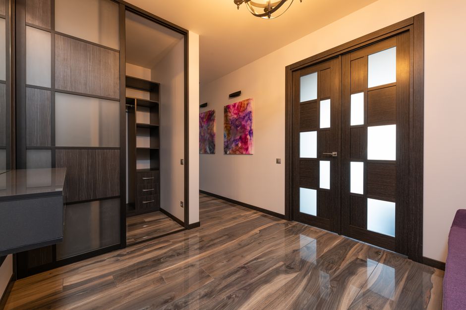 Elegant wooden sliding door dividing living spaces. Elegant wooden sliding door dividing living spaces.