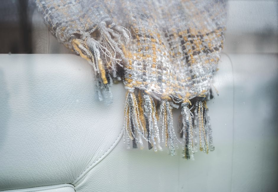 Warm plaid throw enhances stylish fall decor. Warm plaid throw enhances stylish fall decor.