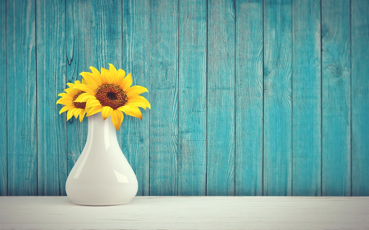 Colorful blooms in stylish vases brighten room.