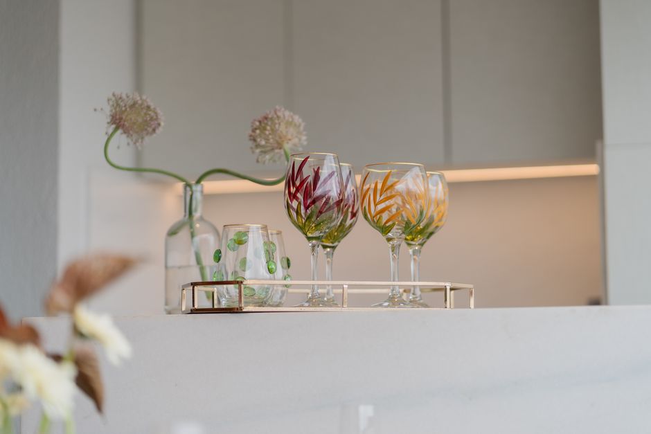 Bright glassware collection as kitchen focal point. Bright glassware collection as kitchen focal point.