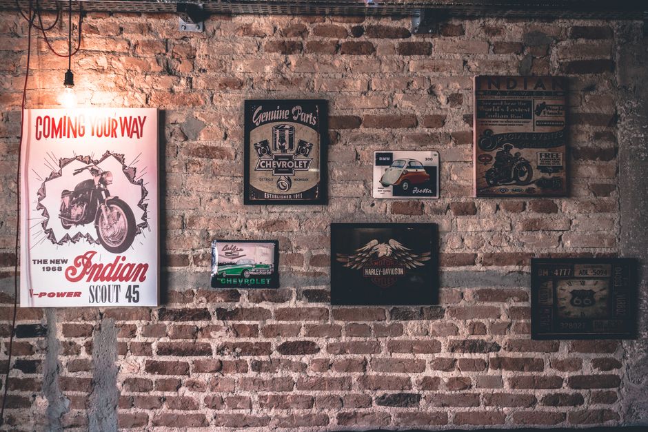 Motorcycle posters adorn informal meeting room walls. Motorcycle posters adorn informal meeting room walls.